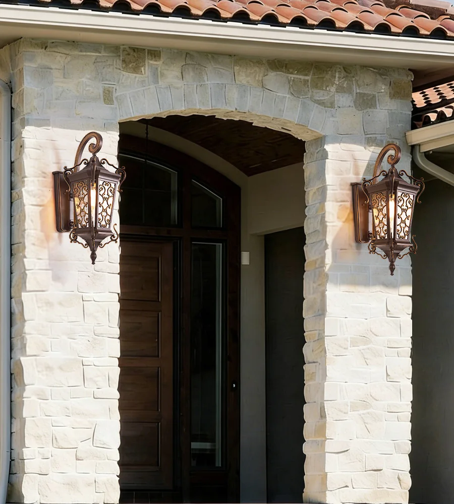 Pair of European outdoor wall lanterns installed beside a villa entrance