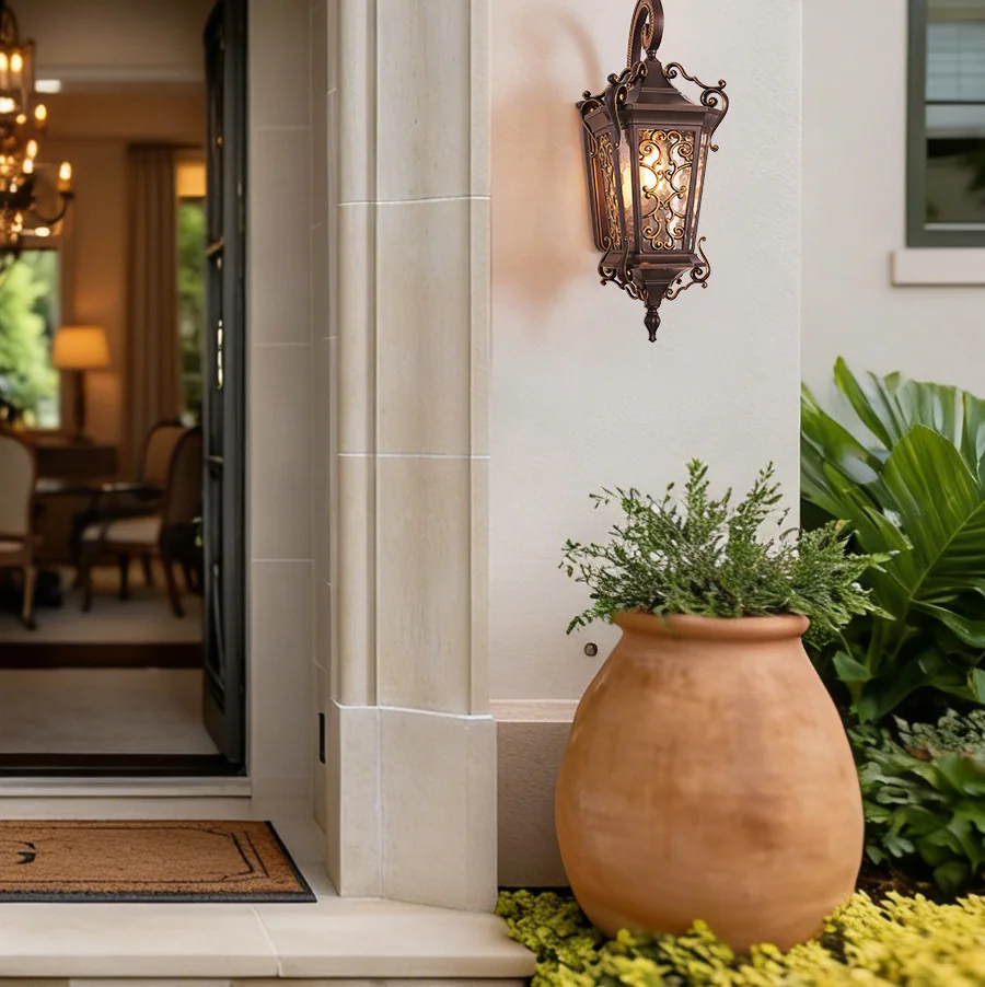 European outdoor wall lantern installed near a covered terrace entrance