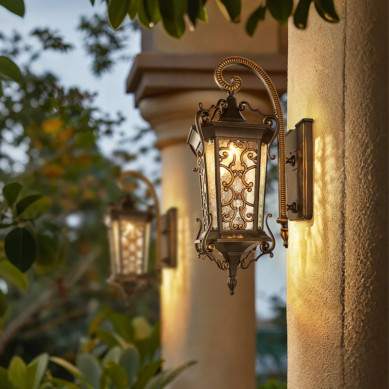 European outdoor wall lantern illuminated on a villa exterior