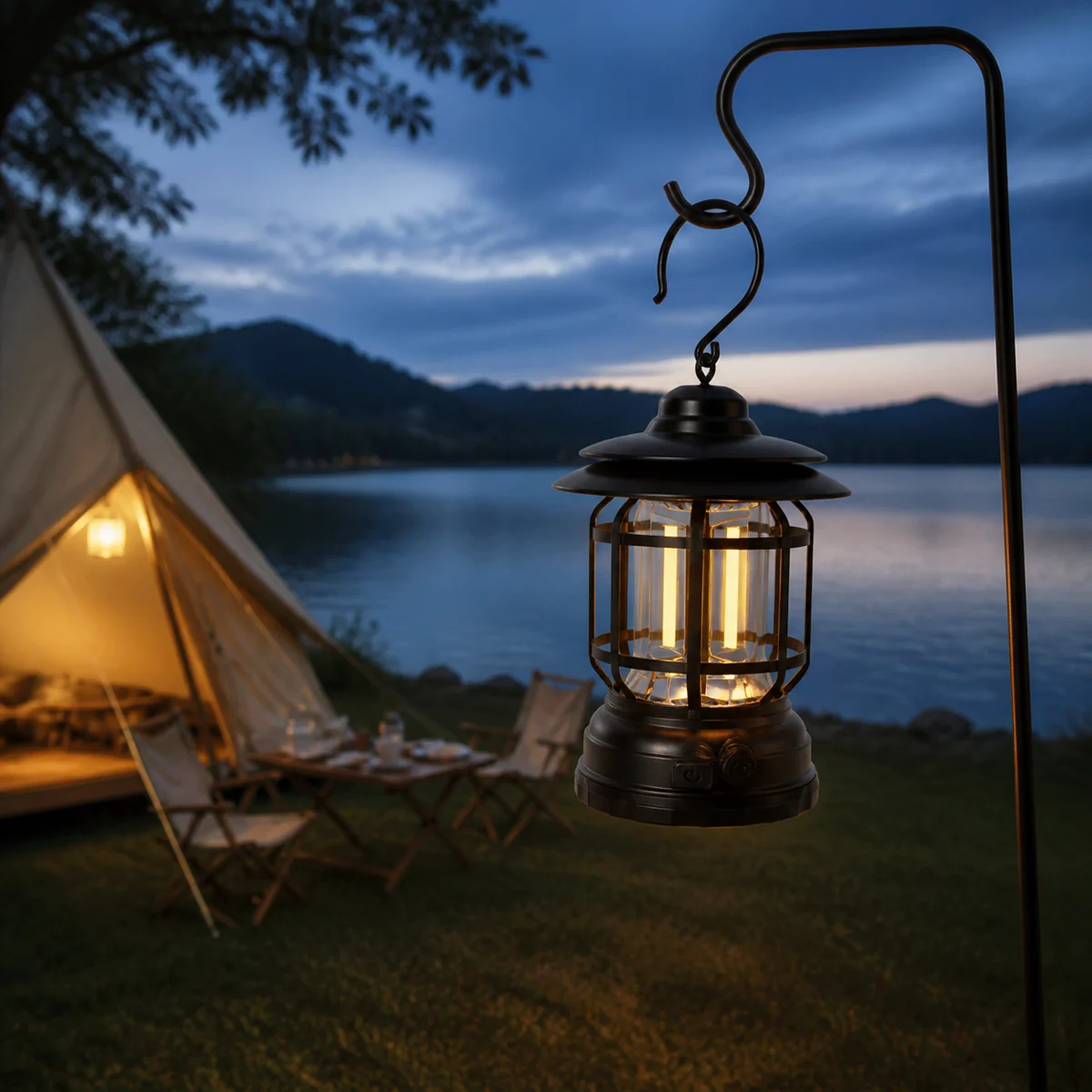 Black L791R retro camping lantern hanging beside a lakeside campsite