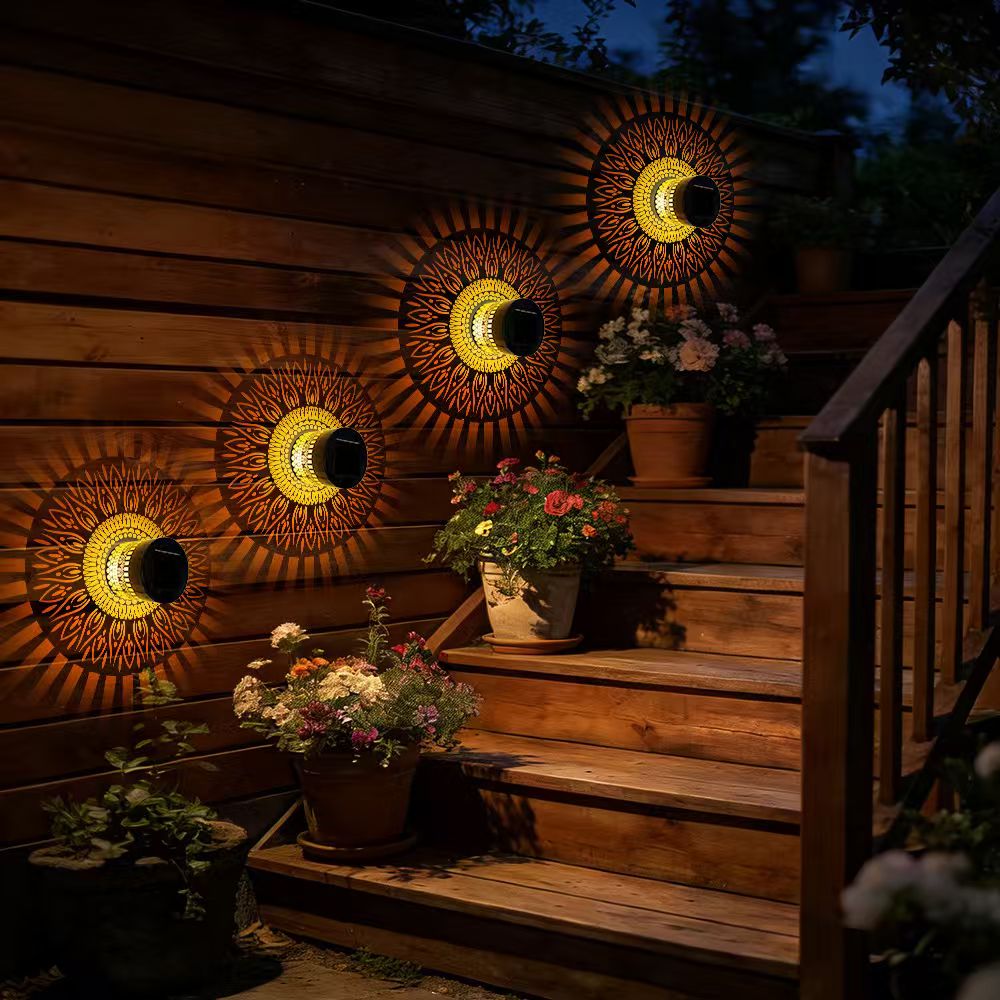 Four life-wheel solar projection lights installed along outdoor wooden steps