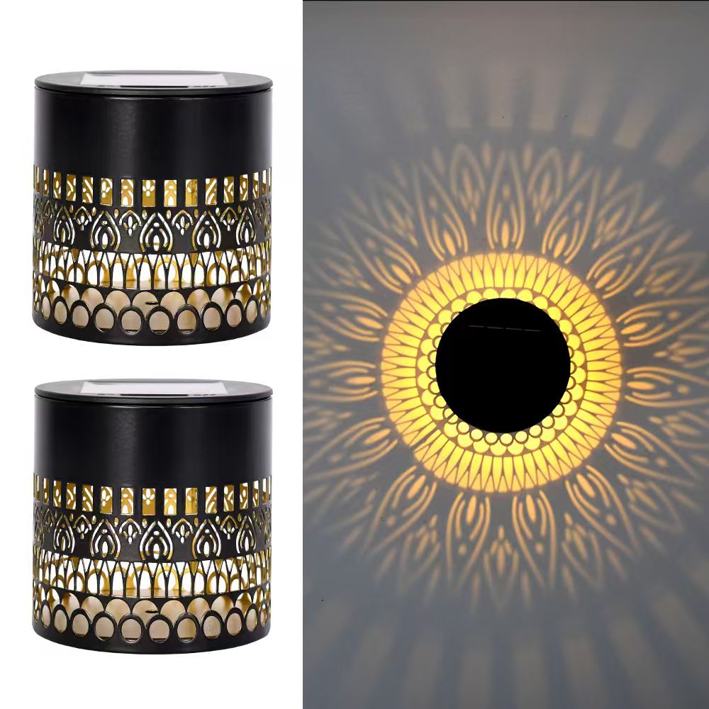 Warm-white solar life-wheel projection light with a decorative circular wall pattern